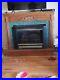 Buck_stove_fireplace_W_gas_logs_with_wooden_mantle_Vent_less_01_nt